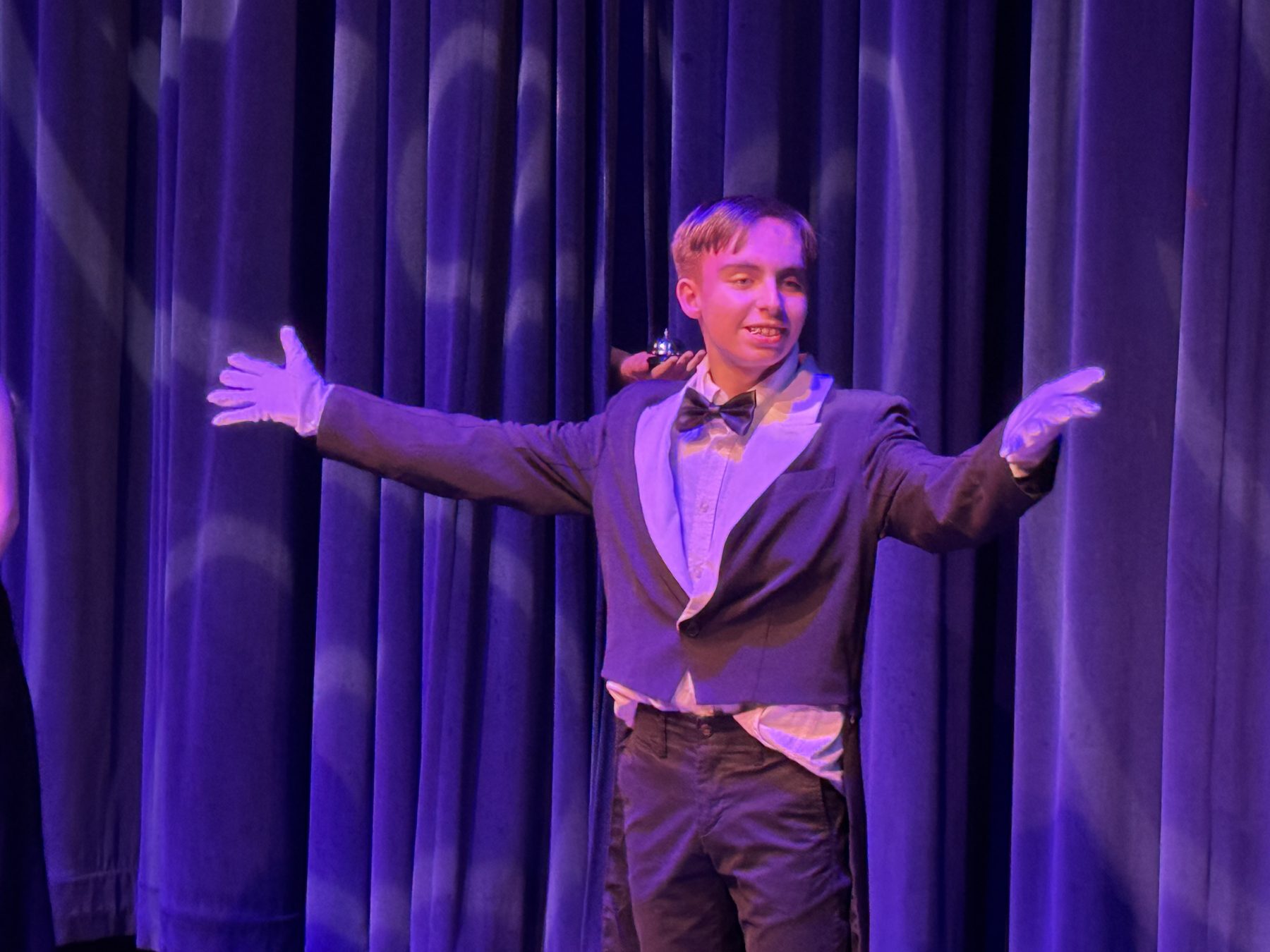 Van mid-monologue in purple light