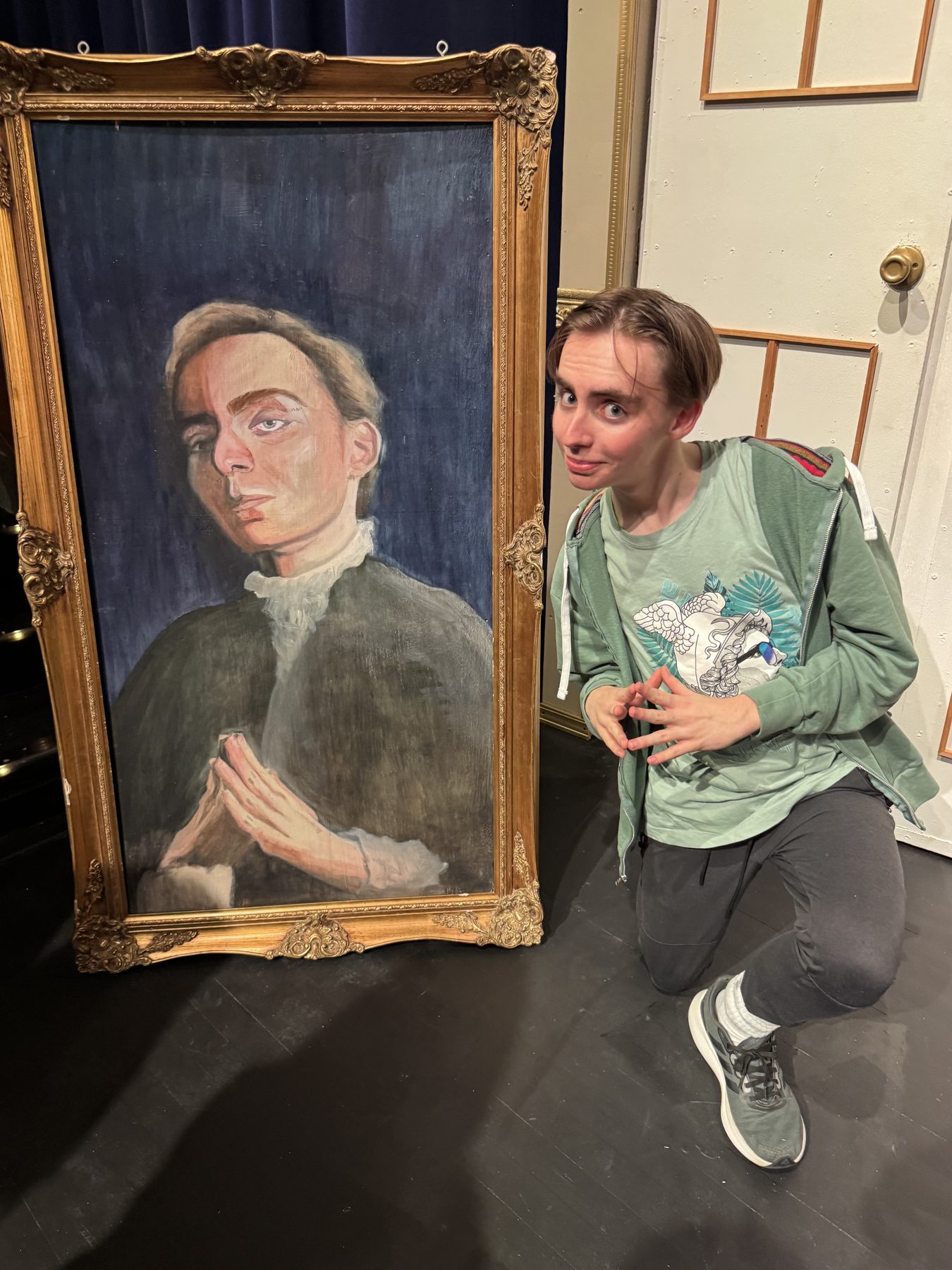 Van in a scene with a gilded portrait frame