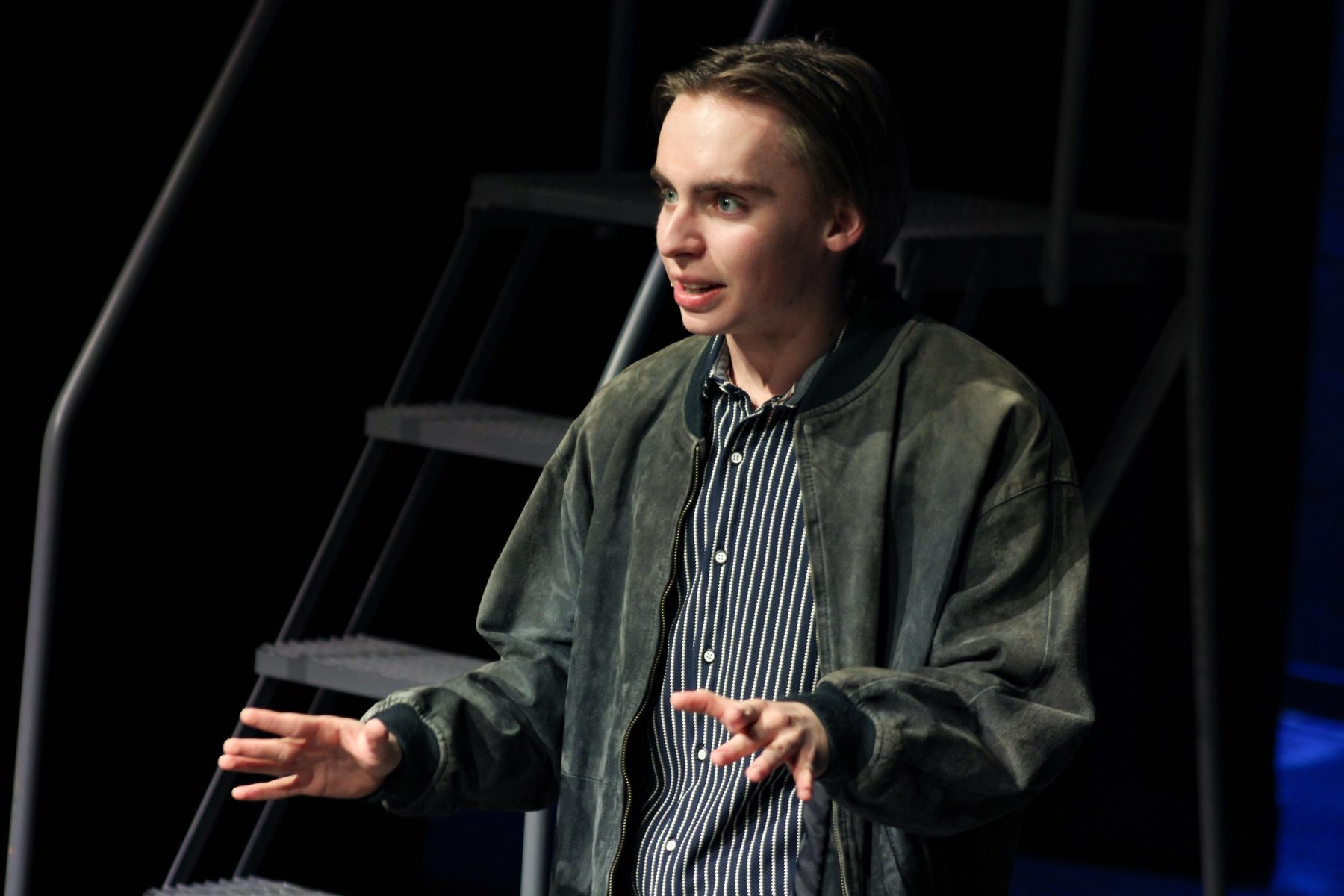 Van delivering a monologue on stage